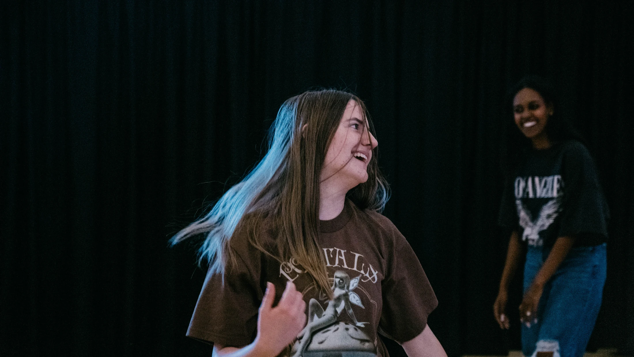 A student smiling during an Avenue Youth gathering