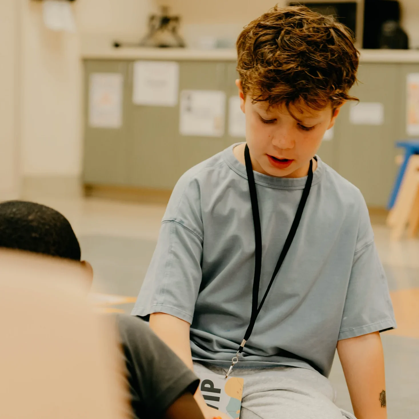 A child enjoying an Avenue Kids classroom activity