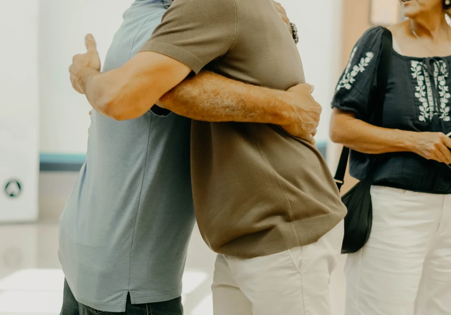 Jeremy greeting a friend in the Avenue Church lobby