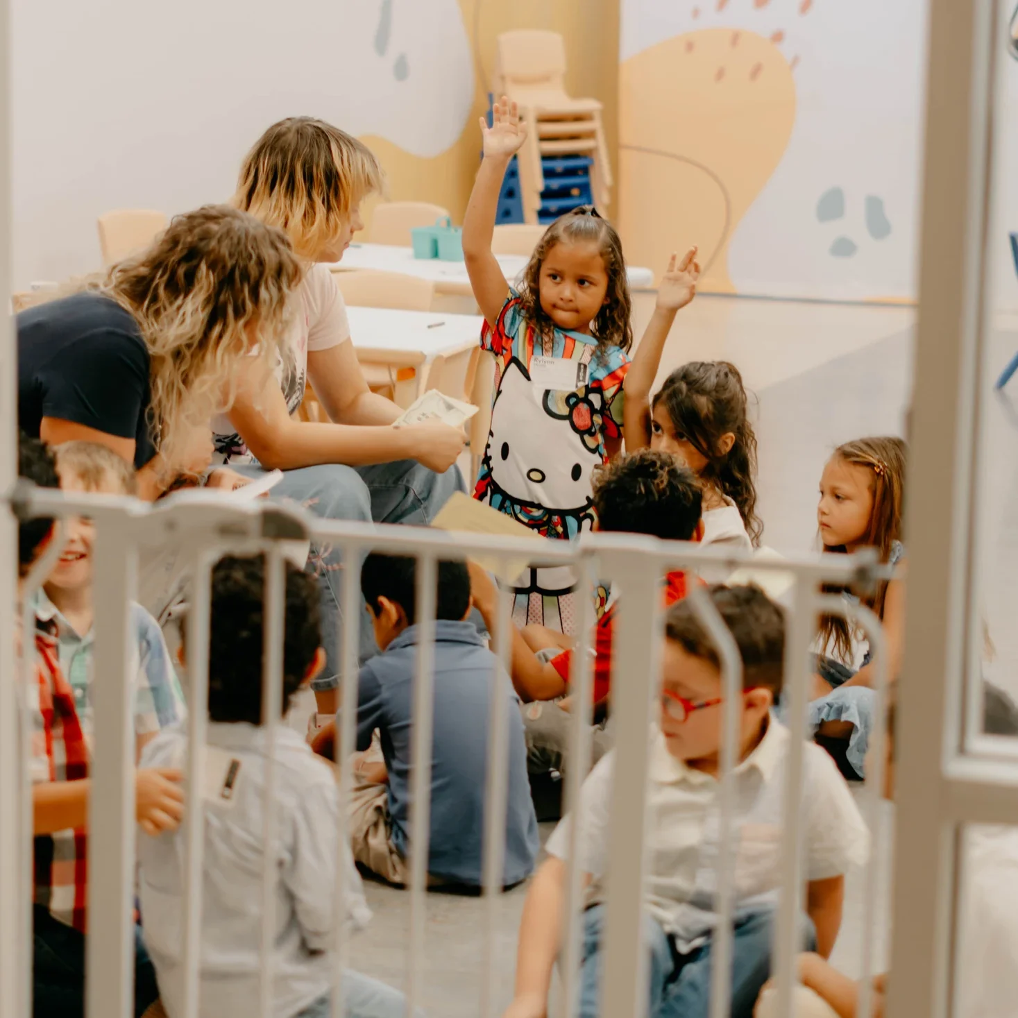 Families checking their children into Avenue Kids